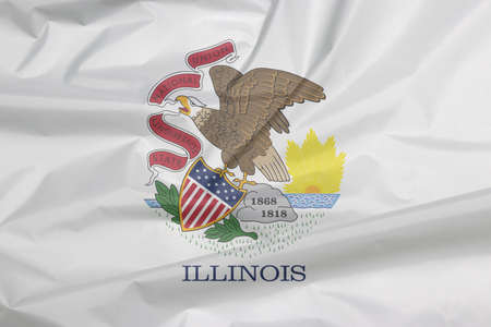 Fabric flag of Illinois. Crease of Illinois flag background, the states of America. Seal of Illinois on a white background.の写真素材