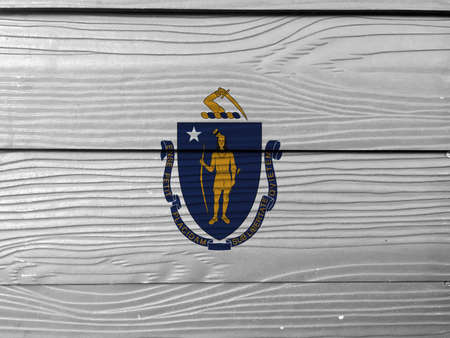 Massachusetts flag color painted on Fiber cement sheet wall background, the states of America. The state coat of arms centered on a white field.の写真素材