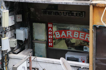 Bangkok, Thailand - Nov 27, 2019 : Thai text, Sala Daeng barber. The barber shop at the city center on Silom road, Bangkok Thailand.のeditorial素材