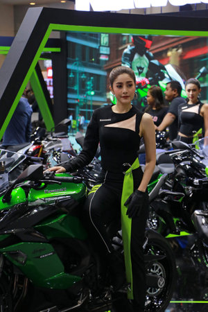 Nonthaburi, Thailand, Dec 06, 2019 : Beautiful Asian Pretty with Kawasaki motorbike, popular...