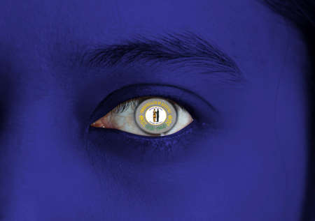 Human face painted Kentucky flag with Commonwealthâs seal on the center of eye or eyeball. Human eye painted with flag of Kentucky.の写真素材