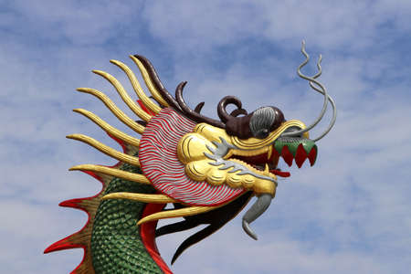 Colorful Dragon head statue on blue sky background.の写真素材