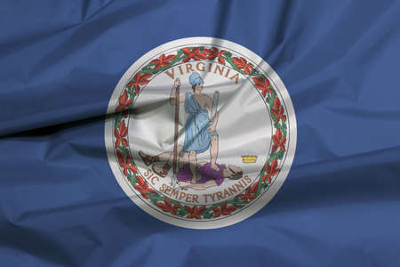 Crease of Virginia fabric flag background. Obverse of the Seal of Virginia on an azure field. The state of America.の写真素材
