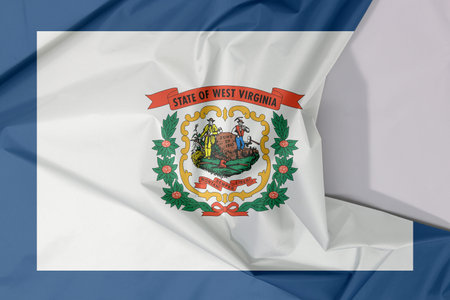 West Virginia fabric flag crepe and crease with white space. A pure white field bordered on four...