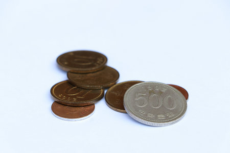 Heap of South Korea won coin money on the white background. Concept of finance or currency.