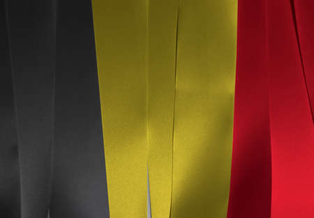 Colorful ribbon as Algeria national flag, it is a vertical tricolor of black yellow and red. の写真素材