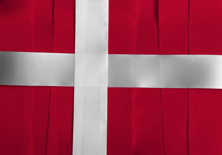 Colorful ribbon as Denmark national flag, red with a white Scandinavian cross that extends to the edges of the flag.の写真素材