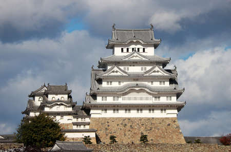 Himeji, Hyogo, Kansai, Japan November 19, 2017: White Himeji Castle on the sunlight with blue sky background. Himeji Castle also known as White Heron Castle (Shirasagijo) due to its elegant, white appearance, is widely considered as Japan's most spectaculのeditorial素材