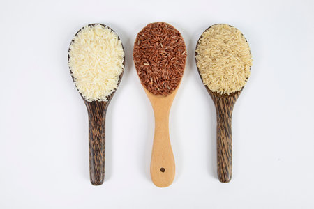 Set of rice collection on ladle isolated on white background.