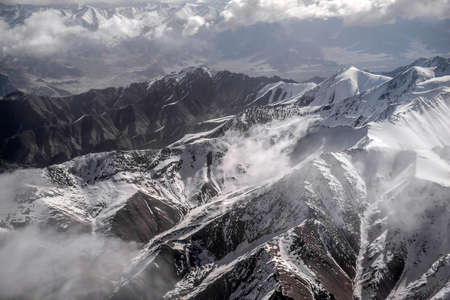 Winter landscape snow mountain high angle view from airplane Leh Ladakh India.の写真素材