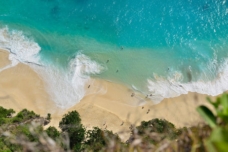 Aerial view of seascape blue ocean wave on sandy beach background.