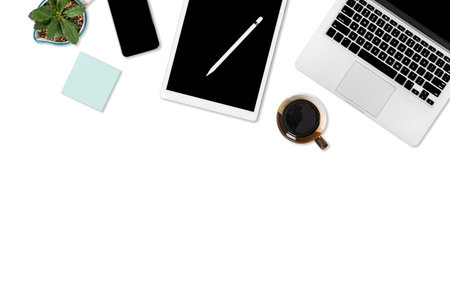 Flat lay photo of office table with laptop computer, digital tablet, mobile phone and accessories....