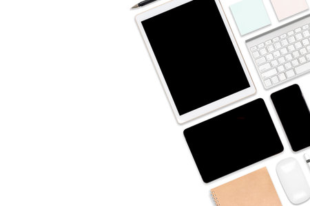 Flat lay photo of office table with laptop computer, digital tablet, mobile phone and accessories....