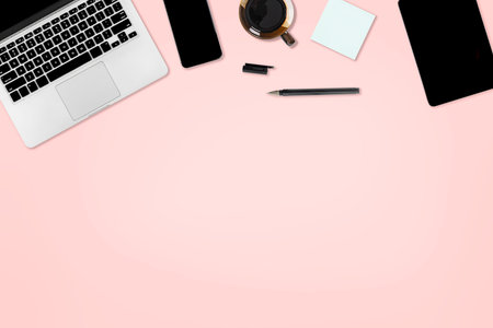 Flat lay photo of office table with laptop computer, digital tablet, mobile phone and accessories....