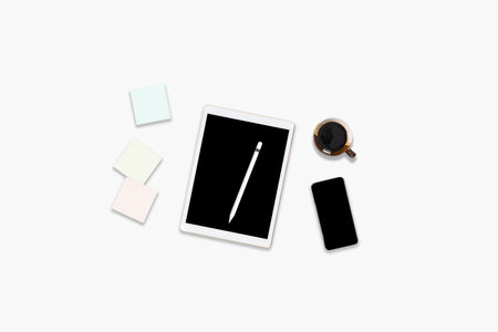 Flat lay photo of office table with digital tablet computer, mobile phone and accessories. on...