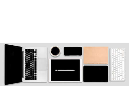 Flat lay photo of office table with laptop computer, digital tablet, mobile phone and accessories. on modern tone background. Desktop office mockup concept.の写真素材