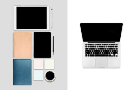 Flat lay photo of office table with laptop computer, digital tablet, mobile phone and accessories. on modern tone background. Desktop office mockup concept.の写真素材