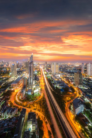 Amazing beautiful view of midtown Bangkok city skyline and skyscraper at sunset.