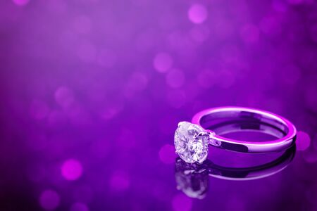 Diamond Ring on Purple Blur Backgroundの写真素材