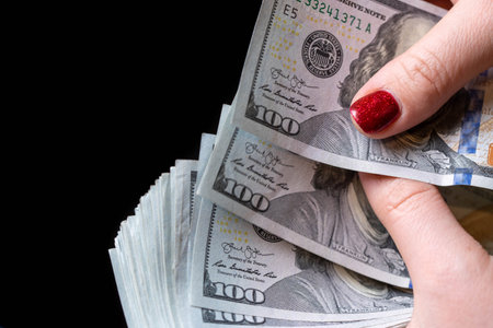 Women Counting a Lot of 100 Dollars