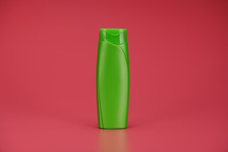 Blank Label Shampoo Green Bottle or Shower Gel on Pink Backgroundの写真素材