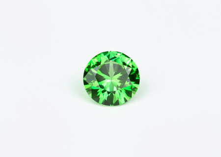 Green sapphire on a white background close-up macro shootingの素材