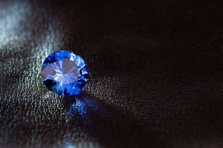 Blue sapphire on a dark background close-up macro photographyの素材