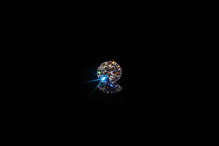 Shiny diamond on black background. Jewelry and luxury concept.の写真素材