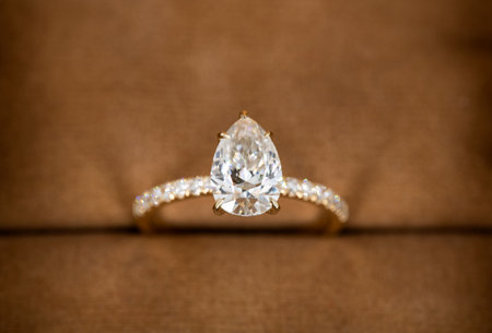 Jewelry diamond ring on a brown background. Selective focus.の写真素材