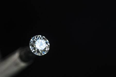 Jewelry diamond on a black background. Macro shot with shallow depth of field.の写真素材