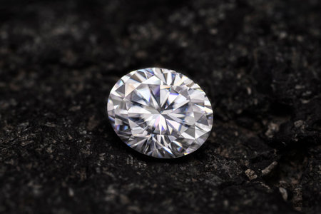 Brilliant diamond on a black background. Macro shot. Jewelry background.の写真素材