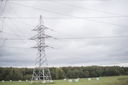 Power pole on sky background. Wires conducting electricity.