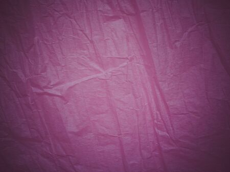 Purple wrinkled texture. Damaged purple paper. Violet crumpled sheet. Packaging. Rough texture background.の写真素材