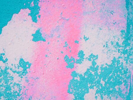 Abstract painting colorful background texture. Pastel color. Turquoise and pink shabby concrete wall with flaky plaster. Vintage, cracked distressed background. Virid paint stains on white canvas.の写真素材