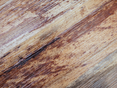 Thai or Asian handwork. Pressed bamboo surface. Natural wooden background. Brown and grey leaves texture. Abstract pattern. Excellent natural concept for interior exterior decoration or any design.の写真素材