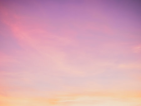 Majestic dusk. Twilight in the evening with gentle sunlight. Pastel colours. Abstract nature background. Pink, purple, lilac and yellow colors of clouds in sunset skyの写真素材