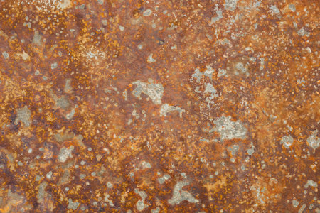 Corrosion. Metal plate with weathered colors and rust. Orange metal plate. Old oxidized colorful...