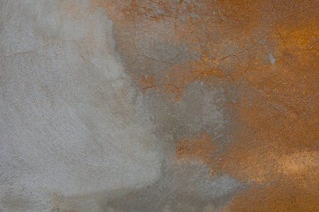 Tile or stone surface in bright orange and gray colors. Art cement texture background with spot like...