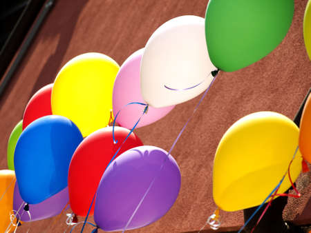 balloons flying in the blu skyの写真素材