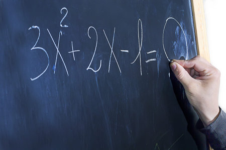 mathematical formula written on chalkboard