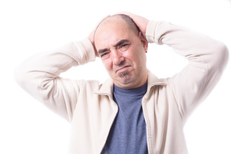 Man with his hands on His Headの写真素材