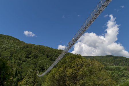 suspended bridge of the Ferriere is a pedestrian walkway that connects the two sides of the Lima...