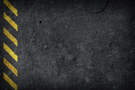 Black construction background and warning stripesの写真素材
