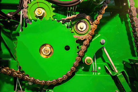 Close-up of the gears and chain of a modern agricultural tractorの写真素材