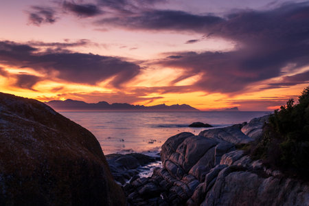 View of a cloudy sunrise from Boulders beach with a view of False Bay, Simon's Town, Cape Town,...