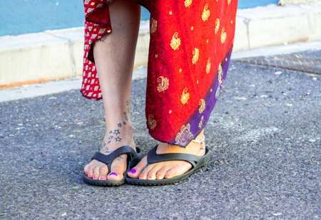 Lower body photo of a Women in a brightly colored blue and red dress, Cape Town, South Africaの写真素材
