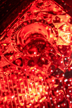 High contrast red macro photography texture backgrounds, vehicle reverse light bulb with water drops onの写真素材