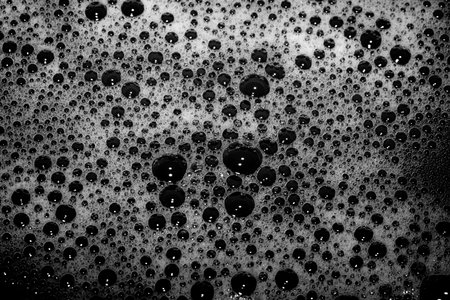 High contrast Black and white macro photography texture backgrounds, soapy bubbles in water