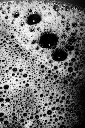High contrast Black and white macro photography texture backgrounds, soapy bubbles in water