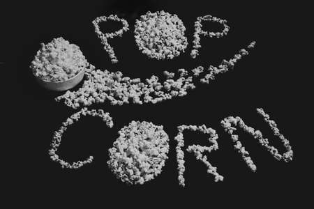 Popped Popcorn (maize kernels) and shaped in the word âpopcornâの写真素材